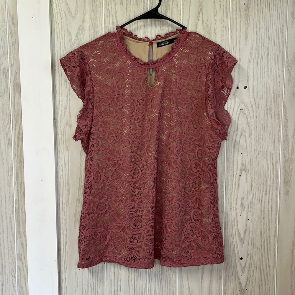 Cure XL layered pink shirt sleeve lace top. Ruffled sleeves with tan underlay.